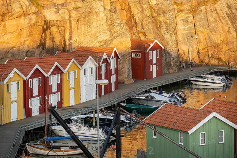 Colourful boathouses and boats in the harbour of Smögen, evening mood, Smögenbryggan, Västra Götalands Län, Bohuslän, Sweden