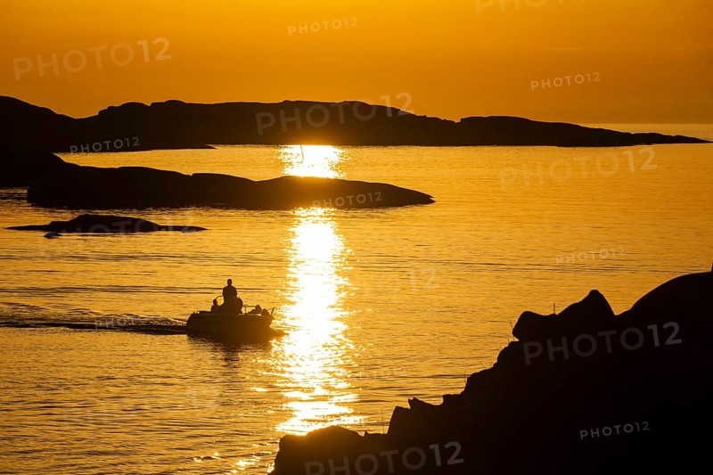 Motorboat between archipelago at sunset, archipelago landscape, Smögen, Smögenbryggan, Västra Götalands Län, Bohuslän, Sweden