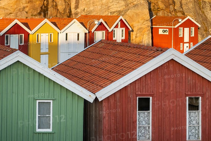Colourful boathouses between rocks in the harbour of Smögen, Smögenbryggan, Västra Götalands Län, Bohuslän, Sweden