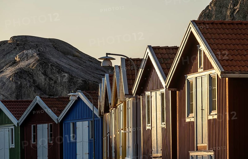 Boathouses between rocks in the harbour of Smögen, Smögenbryggan, Västra Götalands Län, Bohuslän, Sweden