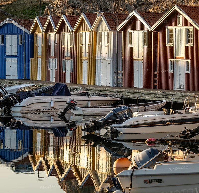Boats and colourful boathouses in the harbour of Smögen, Smögenbryggan, Västra Götalands Län, Bohuslän, Sweden