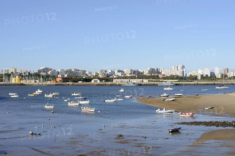View over the mouth of the river Arade with fishing boats to Portimao, Ferragudo, Algarve, Portugal