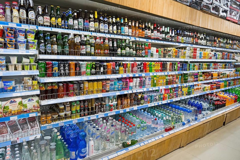 A supermarket shelf full of various drinks and refreshments, Gntunik supermarket, Aragazotn province, Armenia