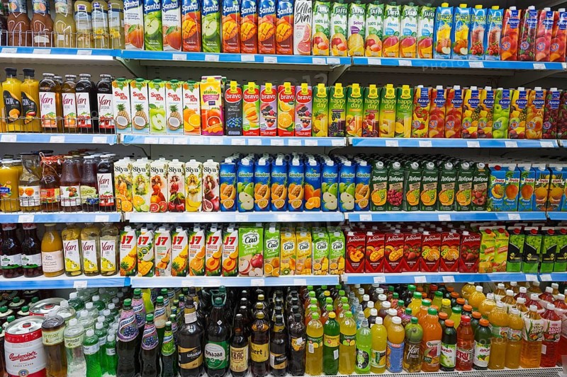 A shelf full of bottles of juices and other drinks in various flavours, Gntunik supermarket, Aragazotn province, Armenia
