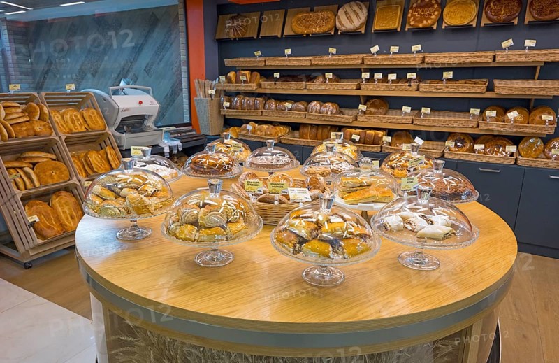 Various pastries and breads are decoratively displayed in a bakery, Gntunik supermarket, Aragazotn province, Armenia