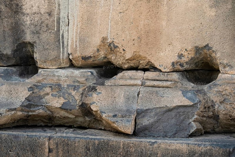 Fragment of a stone wall of an ancient temple made of tufa, Garni, Armenia