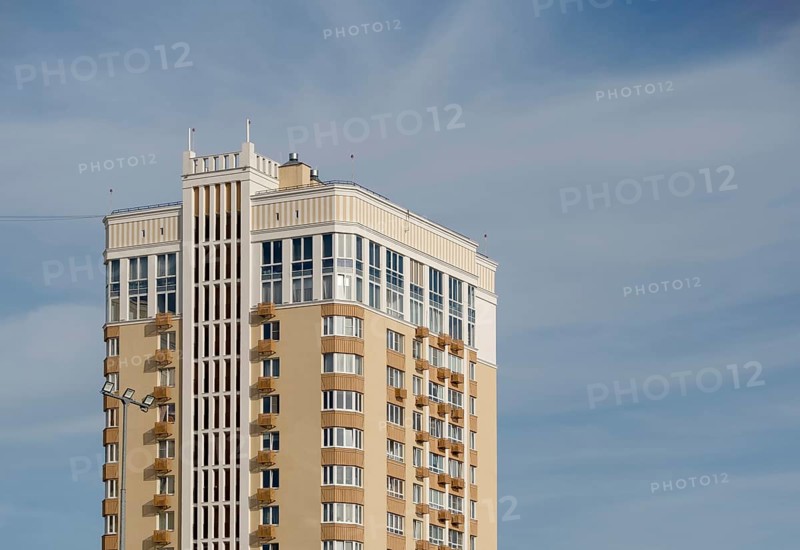Modern multi-storey building against sky, copy space