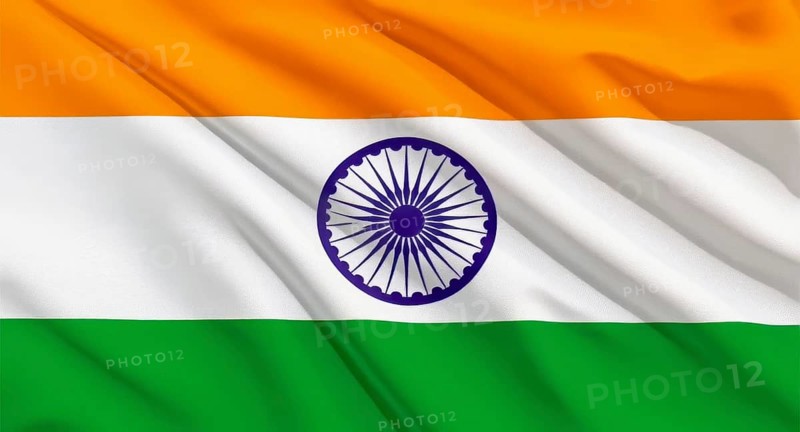 The national flag of India, a tricolor with saffron, white, and green stripes, and the Ashoka Chakra in the center, is waving, AI generated