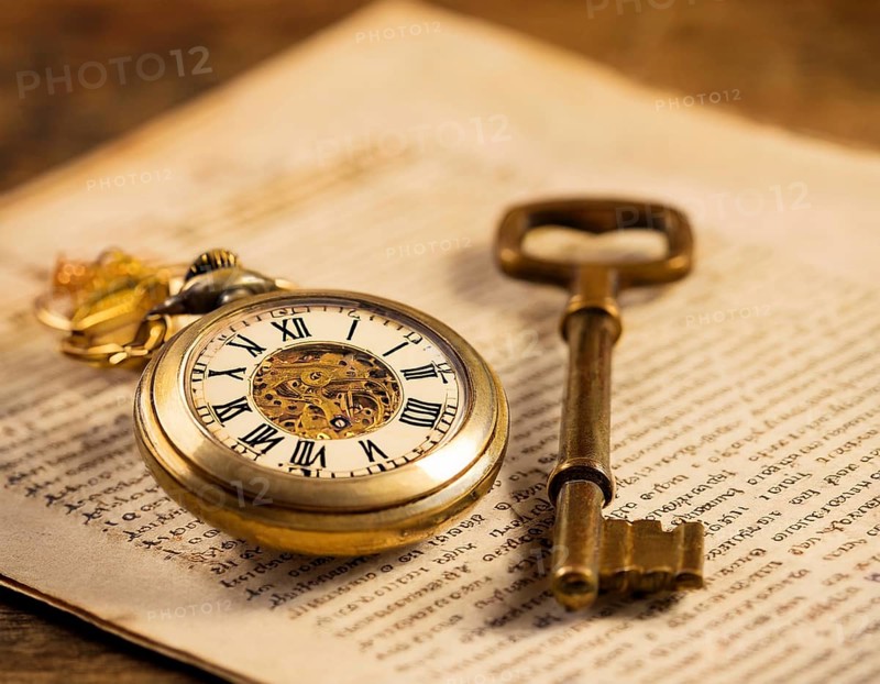 A classic golden pocket watch and ornate key resting atop an aged newspaper, symbolizing time and heritage. The scene exudes vintage charm and historical nostalgia, ideal for themes of timeless beauty, AI generated