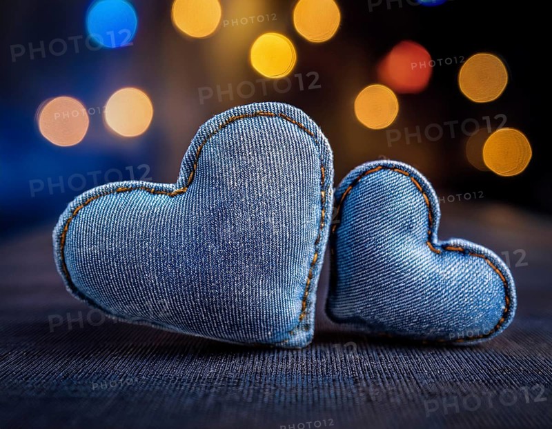 A beautiful heart-shaped denim pillow, symbolizing love and creativity, designed from repurposed blue denim. Showcasing intricate stitching and a distinctive design. Perfect for concepts of love, fashion, or upcycling handmade projects, AI generated