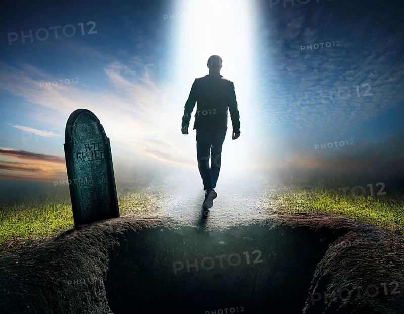 A silhouette of a lone figure walking off a gravestone, The scene evokes Resurrection thoughts emotional depth, AI generated