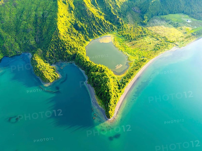 Lagoa do Fogo Lake at Sunrise. Green Lush Hills with Trees. Azores, Sao Miguel Island. Portugal. Aerial Overhead High Angle Shot