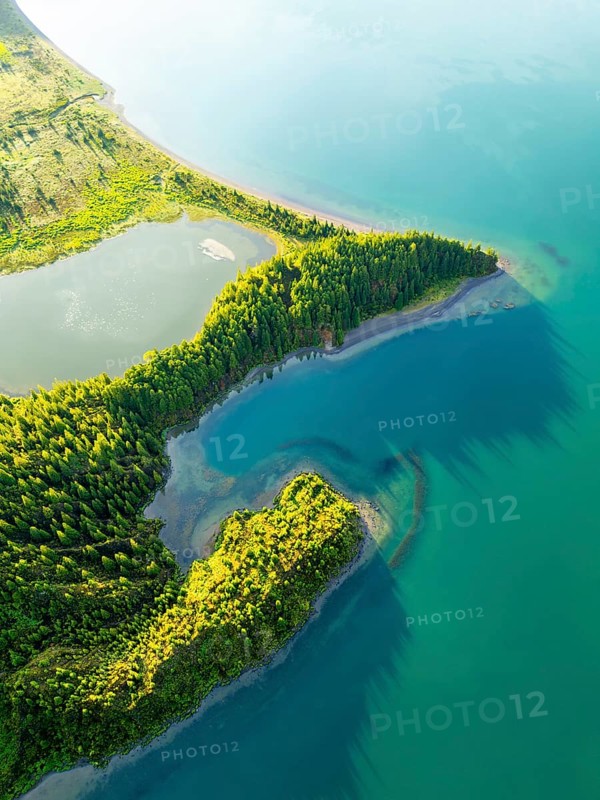 Lagoa do Fogo Lake at Sunrise. Green Lush Hills and Forest. Azores, Sao Miguel Island. Portugal. Aerial Overhead High Angle Shot