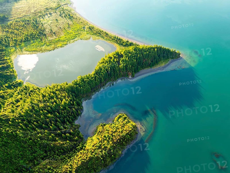 Lagoa do Fogo Lake on Sunny Morning. Green Lush Hills and Forest. Azores, Sao Miguel Island. Portugal. Aerial Overhead High Angle Shot