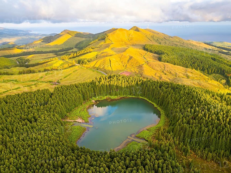 Hills, Forest and Lake Lagoa do Canario at Sunset. Azores, Sao Miguel Island, Portugal. Aerial View