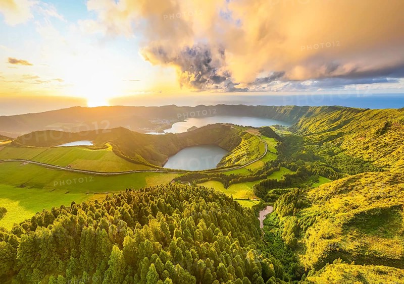 Panorama of Sete Cidades Caldera at Sunset. Blue Lake, Lake Rasa and Santiago Lake. Forest and Hills with Pasturelands. Azores, Sao Miguel Island. Portugal. Aerial Panoramic Shot