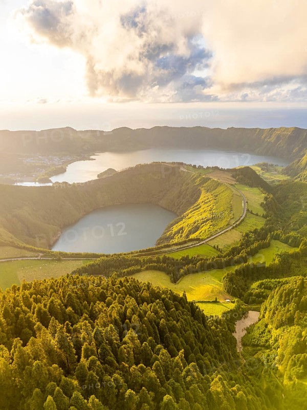 Sete Cidades Massif on Sunny Evening. Blue Lake and Santiago Lake. Forest and Hills with Pasturelands. Azores, Sao Miguel Island. Portugal. Aerial View
