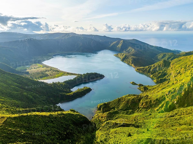 Lagoa do Fogo Crater Lake at Sunrise. Green Lush Hills and Mountains. Azores, Sao Miguel Island. Portugal. Aerial Drone Shot