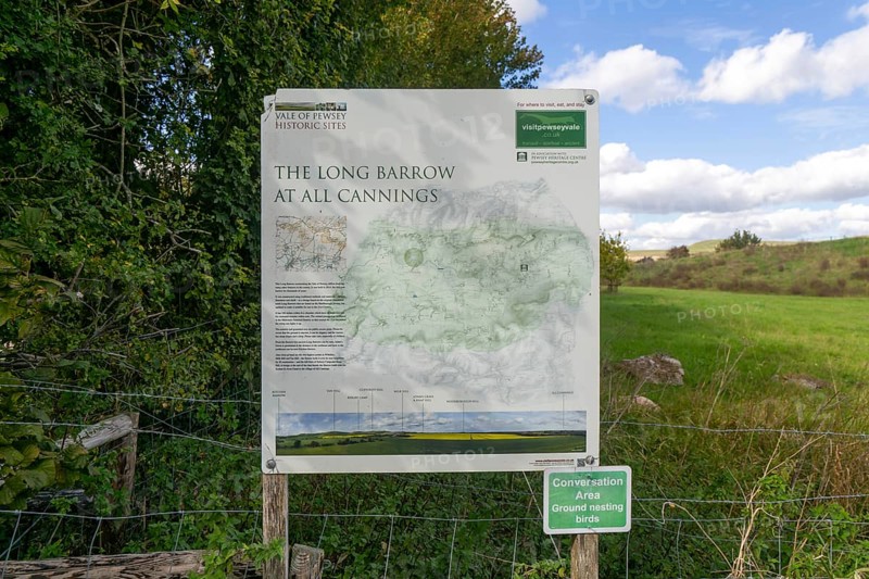 Information notice sign, Modern-day neolithic style long Barrow burial chamber for storing cremation urns, All Cannings, near Devizes, Wiltshire, UK built 2014