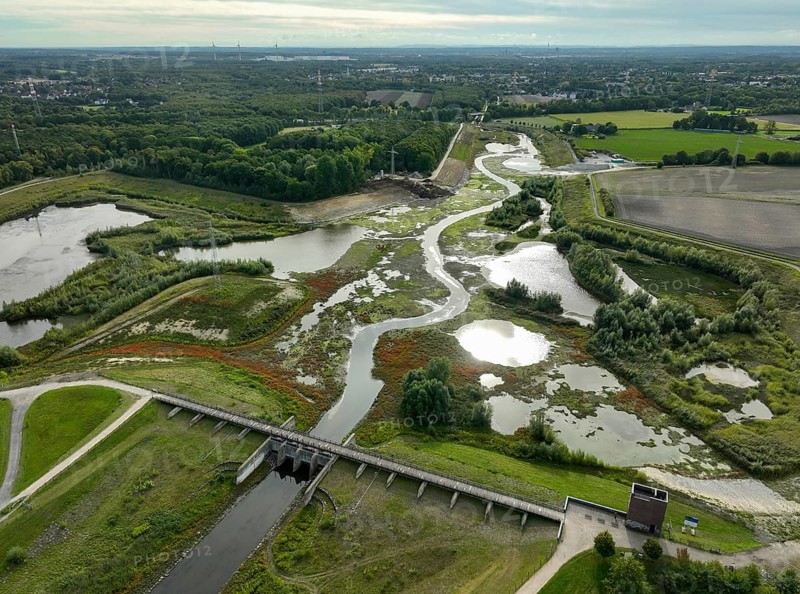 Dortmund, Castrop-Rauxel, North Rhine-Westphalia, Germany - River renaturalisation, renaturation of the Emscher, flood retention basin HRB Mengede. A new floodplain landscape is being created at the Emscher-Auen farm, expanding the area for flood protection during heavy rainfall and for biodiversity. The previously straightened Emscher is being given curves again and can meander through its new floodplain. Following the construction of a parallel sewer, the Emscher has been completely free of sewage since 2022. The river was previously an open, above-ground combined sewer with rainwater and wastewater