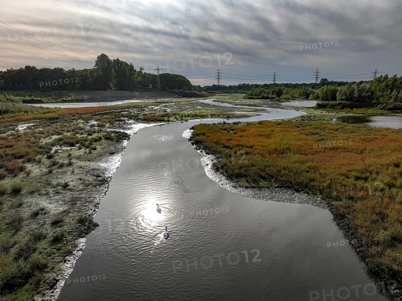 Dortmund, Castrop-Rauxel, North Rhine-Westphalia, Germany - River renaturalisation, renaturation of the Emscher, flood retention basin HRB Mengede. A new floodplain landscape is being created at the Emscher-Auen farm, expanding the area for flood protection during heavy rainfall and for biodiversity. The previously straightened Emscher is being given curves again and can meander through its new floodplain. Following the construction of a parallel sewer, the Emscher has been completely free of sewage since 2022. The river was previously an open, above-ground combined sewer with rainwater and wastewater