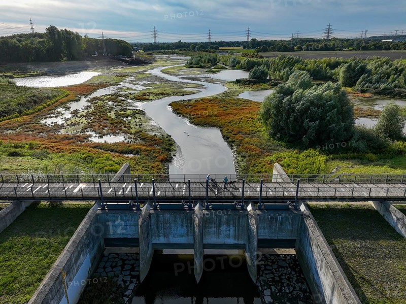 Dortmund, Castrop-Rauxel, North Rhine-Westphalia, Germany - River renaturalisation, renaturation of the Emscher, flood retention basin HRB Mengede. A new floodplain landscape is being created at the Emscher-Auen farm, expanding the area for flood protection during heavy rainfall and for biodiversity. The previously straightened Emscher is being given curves again and can meander through its new floodplain. Following the construction of a parallel sewer, the Emscher has been completely free of sewage since 2022. The river was previously an open, above-ground combined sewer with rainwater and wastewater