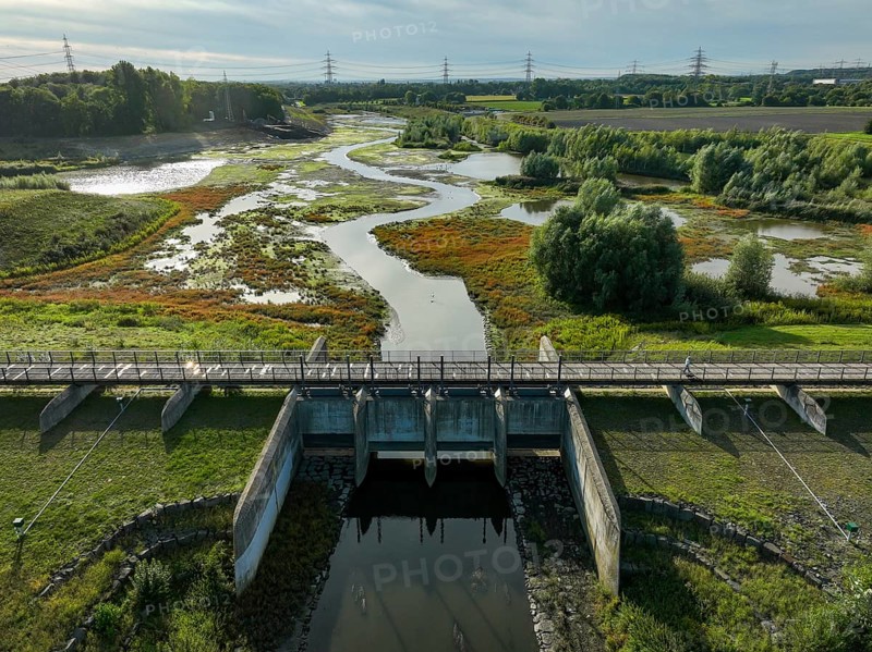 Dortmund, Castrop-Rauxel, North Rhine-Westphalia, Germany - River renaturalisation, renaturation of the Emscher, flood retention basin HRB Mengede. A new floodplain landscape is being created at the Emscher-Auen farm, expanding the area for flood protection during heavy rainfall and for biodiversity. The previously straightened Emscher is being given curves again and can meander through its new floodplain. Following the construction of a parallel sewer, the Emscher has been completely free of sewage since 2022. The river was previously an open, above-ground combined sewer with rainwater and wastewater