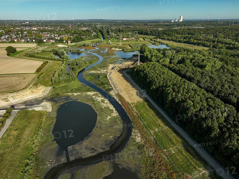 Dortmund, Castrop-Rauxel, North Rhine-Westphalia, Germany - River renaturalisation, renaturation of the Emscher, flood retention basin HRB Mengede. A new floodplain landscape is being created at the Emscher-Auen farm, expanding the area for flood protection during heavy rainfall and for biodiversity. The previously straightened Emscher is being given curves again and can meander through its new floodplain. Following the construction of a parallel sewer, the Emscher has been completely free of sewage since 2022. The river was previously an open, above-ground combined sewer with rainwater and wastewater