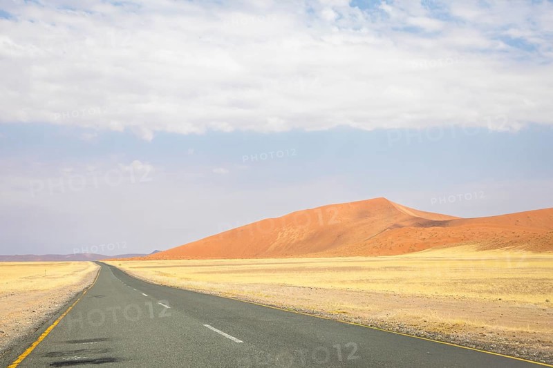 Inside Sossusvlei, gravel roads wind through red dunes to Deadvlei, Big Daddy, and Sesriem Canyon, offering scenic, dusty desert views, Namibia