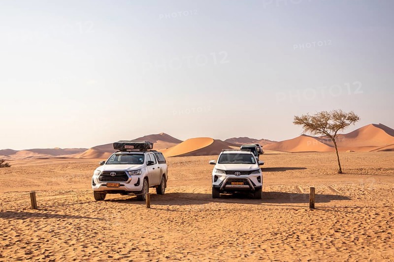 Sossusvlei, Namibia - 27 August, 2025: tracks wind through the vast red dunes, leading explorers across the surreal and remote landscapes of the Namib Desert