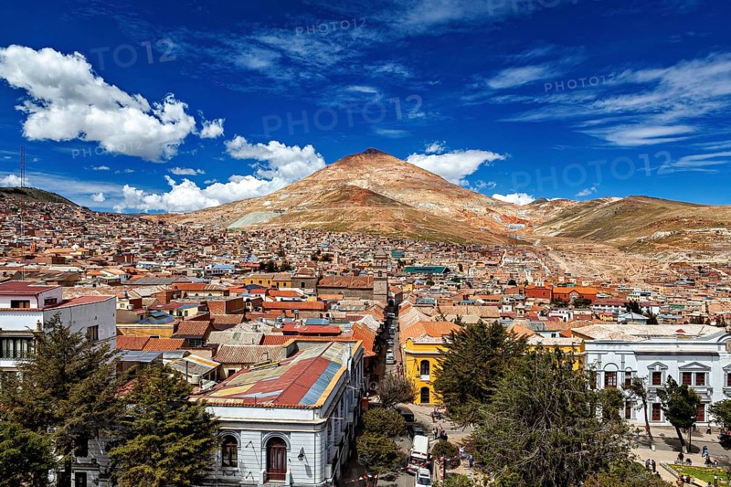 Lively city in front of a high mountain under an expressionist sky, the Cerro Rico silver mountain in Potosi, Bolivia