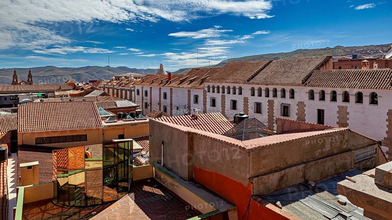 Urban view with tiled roofs under a clear blue sky, The streets of the historic centre of Potosi in Bolivia