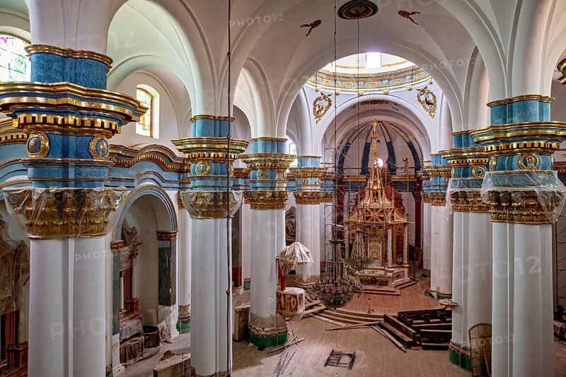 Magnificent church interior with richly decorated arches and altars in blue, white and gold, inside the cathedral of Potosi in Bolivia