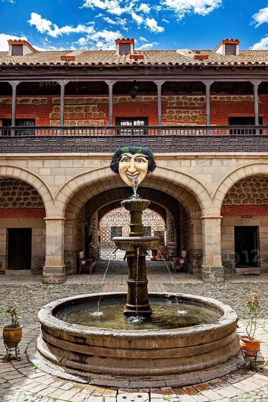 Historic courtyard with decorative fountain and arcades, The courtyard with fountain in the museum of Potosi in Bolivia