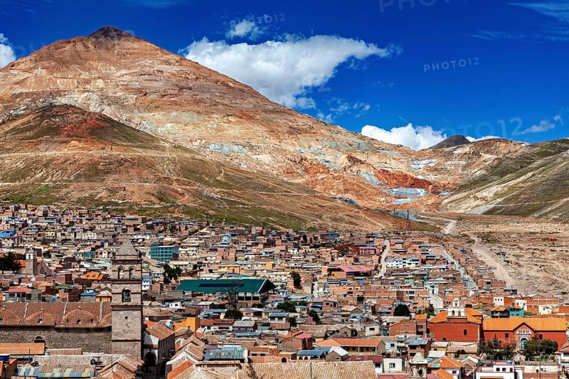 Panorama of a city at the foot of a mountain under a blue sky in the Andes, The silver mountain Cerro Rico above the city of Potosi in Bolivia