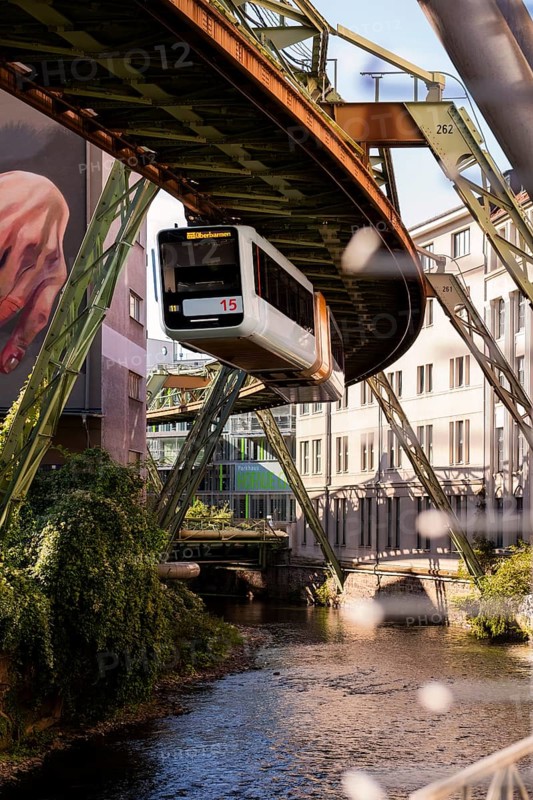 The Wuppertal suspension railway over the riverbed of the Wupper near the Kluse stop, Wuppertal, Germany, digitally reworked