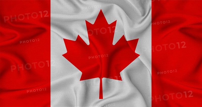 Canada flag waving with fabric texture. Close-up of the Canada flag waving with fabric texture