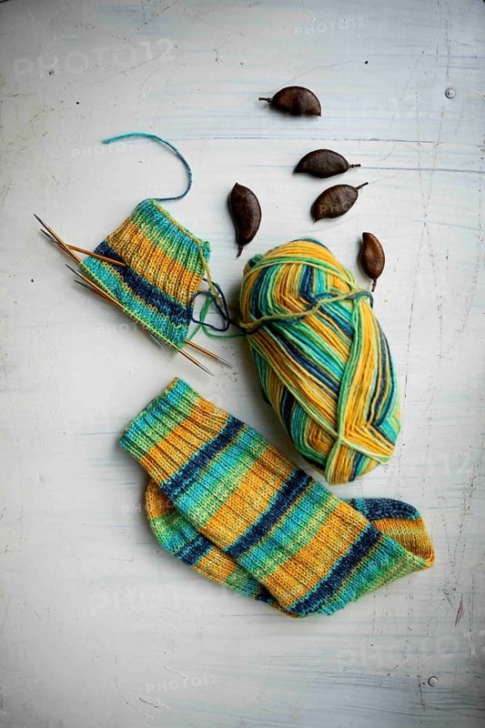 Coloured wool with started knitted sock
