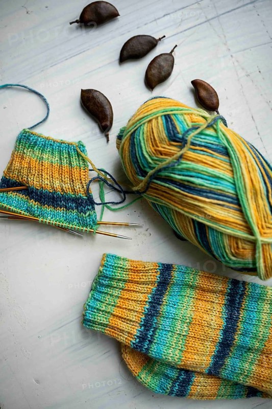 Coloured wool with started knitted sock