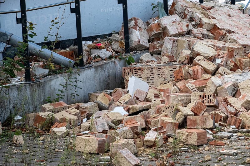 Pile of broken bricks and concrete rubble from a demolished building