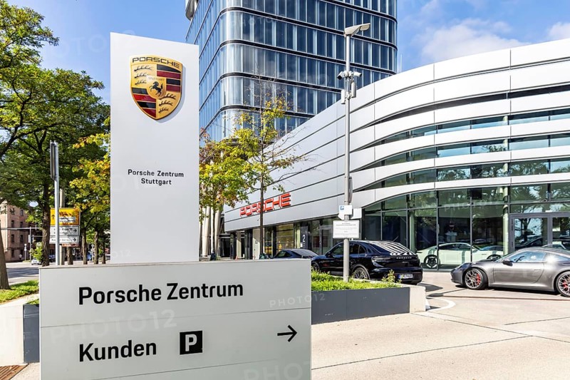 Porsche Centre Autohaus am Pragsattel. Porsche Design Tower skyscraper. Logo on a stele. Stuttgart, Baden-Württemberg, Germany
