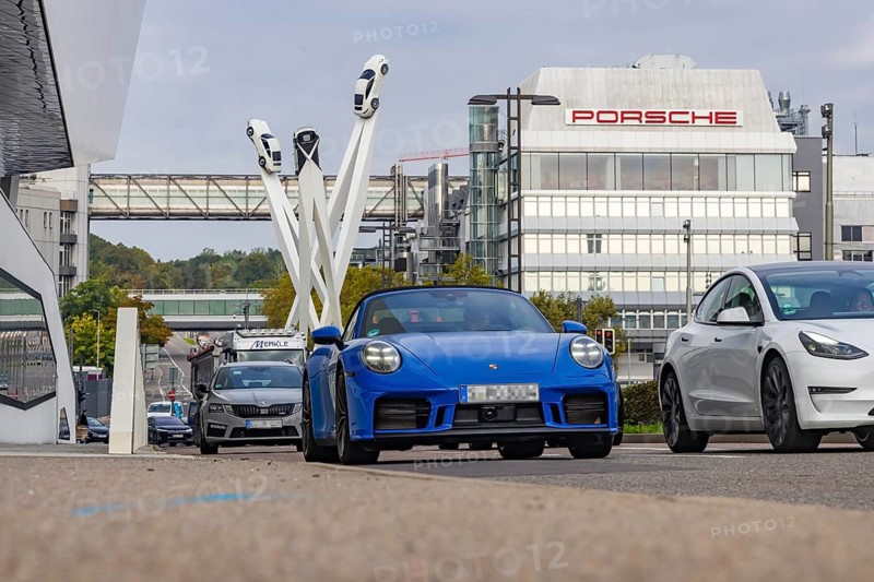 Porscheplatz with Porsche headquarters. Inspiration 911 artwork by Gerry Judah: three steles, each presenting a Porsche 911 at a height of up to 24 metres. Zuffenhausen, Stuttgart, Baden-Württemberg, Germany