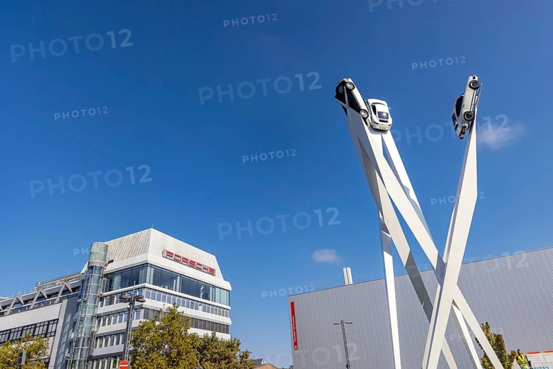 Porscheplatz with Porsche headquarters. Inspiration 911 artwork by Gerry Judah: three steles, each presenting a Porsche 911 at a height of up to 24 metres. Zuffenhausen, Stuttgart, Baden-Württemberg, Germany