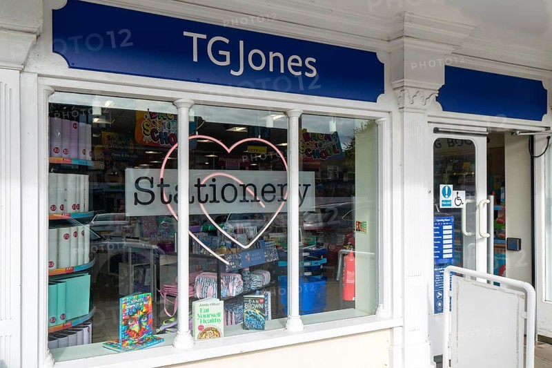 TG Jones shop signage rebranded WH Smith store, High Street, Marlborough, Wiltshire, England, UK