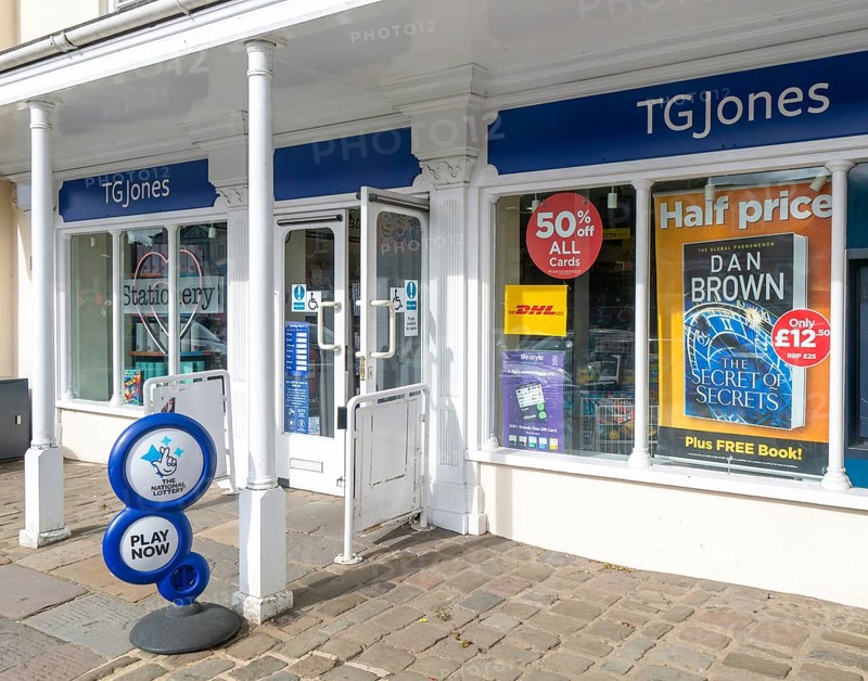 TG Jones shop signage rebranded WH Smith store, High Street, Marlborough, Wiltshire, England, UK