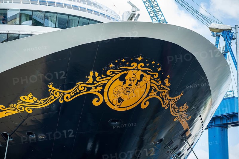 Detailed view of the decorated bow of a cruise ship with a crane in the background, cruise ship in the Meyer shipyard in Papenburg