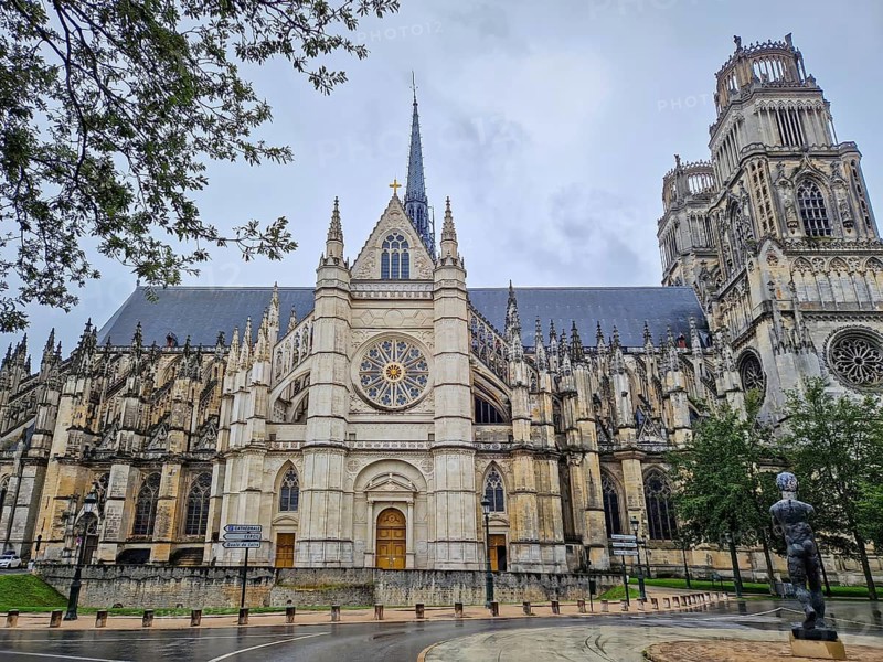 The magnificent Flamboyant Gothic Orleans Cathedral of the Holy Cross on a rainy day. French basilique Sainte-Croix ornate with twin towers and a large rose windows