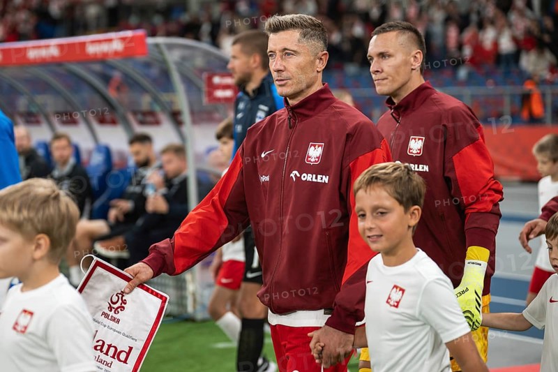 CHORZOW, POLAND - SEPTEMBER 7, 2025: Qualifications for FIFA 2026. Football match Poland vs Finland. referee capitan Robert Lewandowski (L) and tLukasz Skorupski (R)
