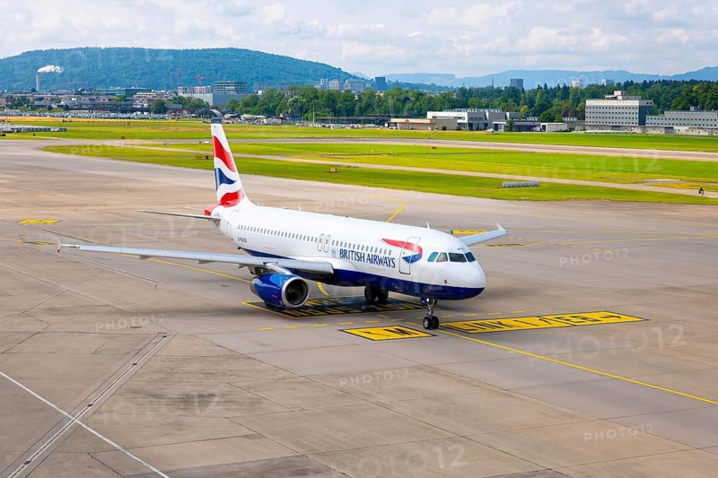 British Airways Passenger Airplane Taxiing on Runway in a Sunny Summer Day From the Airport in Kloten, Zurich, Zurich Canton, Switzerland