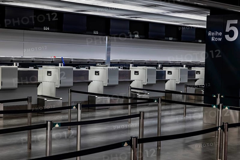 Illuminated and Empty Airport Check in Counter in Zurich Airport at Night in Kloten, Zurich, Zurich Canton, Switzerland